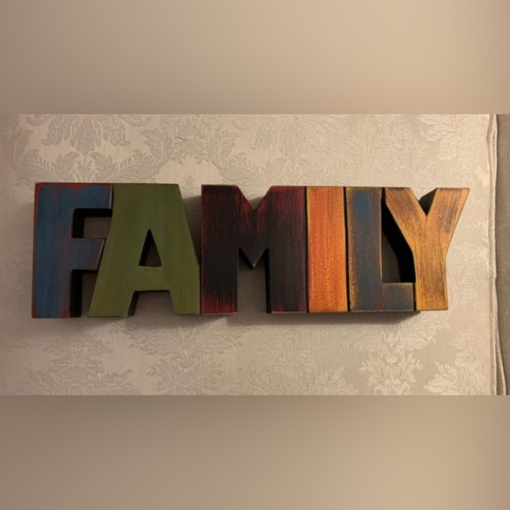 New WOT Wooden “Family” decore. Stands alone. Rustic looking earth tone colors.